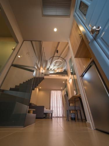 a view of a staircase in a house at Paradise Resort in Finikounta