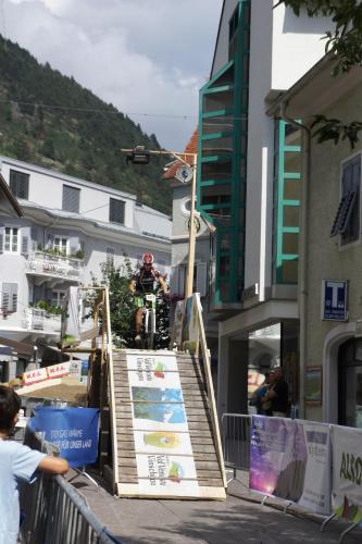 a man riding a motorcycle on a ramp in a city at Pension Pernthaler in Silandro