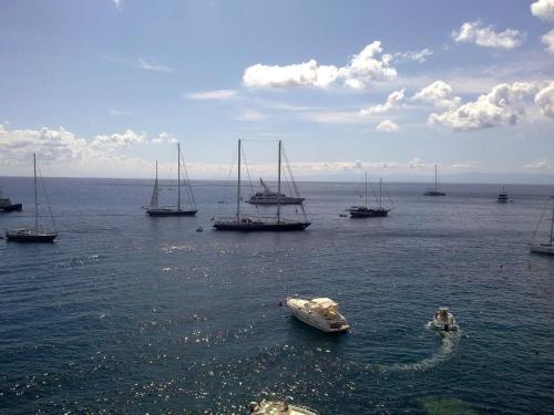 a group of boats in a large body of water at Hotel Rocce Azzurre in Lipari