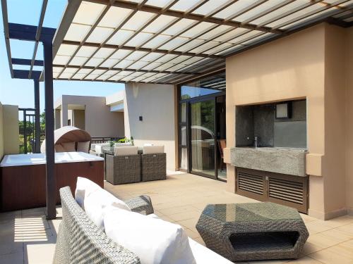 Zona de estar de Zimbali Suites 611