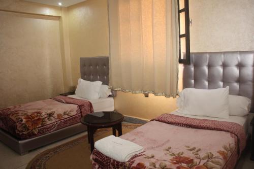 Hôtel Sable d'Or tesisinde bir odada yatak veya yataklar