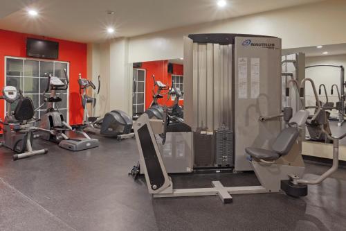 a gym with several treadmills and exercise machines at Radisson Hotel Panama Canal in Panama City