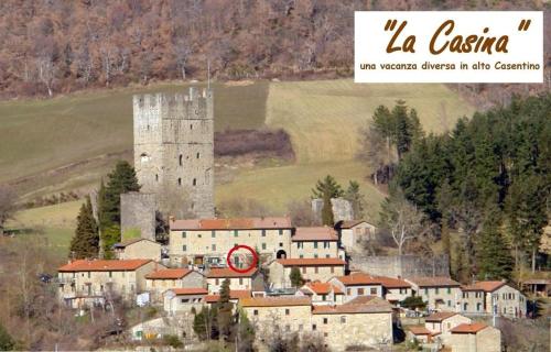 a picture of a castle and a town with houses at La Casina in Stia