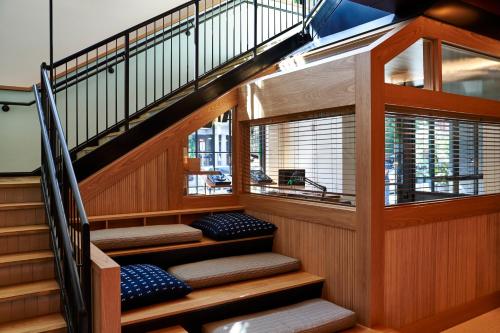 a staircase in a house with wooden stairs with benches at Eaton DC in Washington