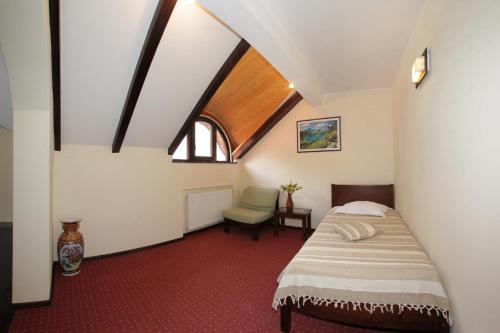 Ένα ή περισσότερα κρεβάτια σε δωμάτιο στο Hotel Victoria