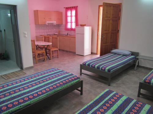 Posteľ alebo postele v izbe v ubytovaní "Action" House in Leonidio 4-beds