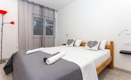 Postel nebo postele na pokoji v ubytování Urban Luxury Suites Juricevic