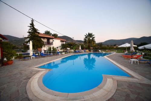 a large blue swimming pool in a resort at Annamaria Studios & Apartments in Petra