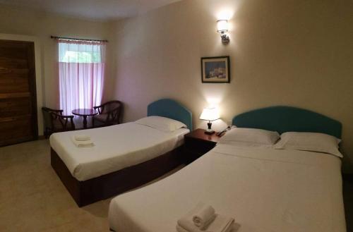 En eller flere senge i et værelse på Mamaungpaa Hill resort