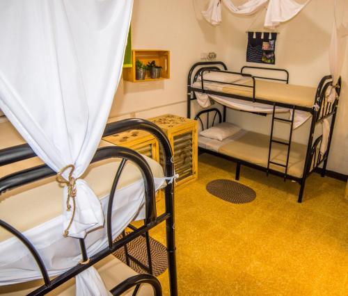 Ένα ή περισσότερα κρεβάτια σε δωμάτιο στο The Purpose Hostel