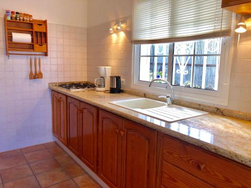 a kitchen with a sink and a window at Casita Vista Valle 35 in El Paso