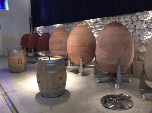 a group of wine barrels and a table at Les Suites Champenoises in Reims