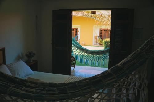 Een bed of bedden in een kamer bij Pouso do Kite Pousada Flecheiras