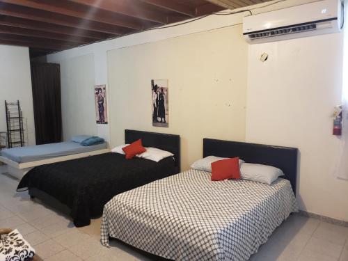 Postel nebo postele na pokoji v ubytování Jardin del Mar Guesthouse