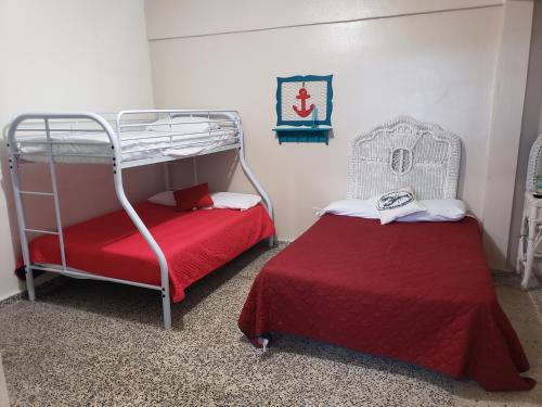 Postel nebo postele na pokoji v ubytování Jardin del Mar Guesthouse