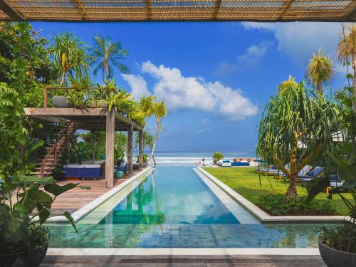 a view of the infinity pool at the resort at Noku Beach House by Elite Havens in Seminyak