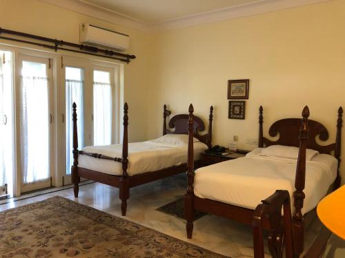 Voodi või voodid majutusasutuse Barwara Kothi toas
