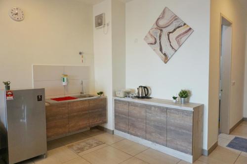 a kitchen with a sink and a counter top at PM Octagon Ipoh Suites & Apartment 2 in Ipoh