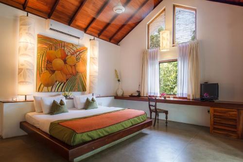 Kama o mga kama sa kuwarto sa Sigiriana Resort by Thilanka