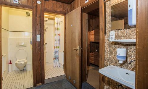 a bathroom with a toilet and a sink at Hocheckhuette On Top of the Kitzbuehel Hahnenkamm Mountain in Kitzbühel