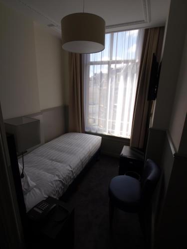 Кровать или кровати в номере Hotel Clemens