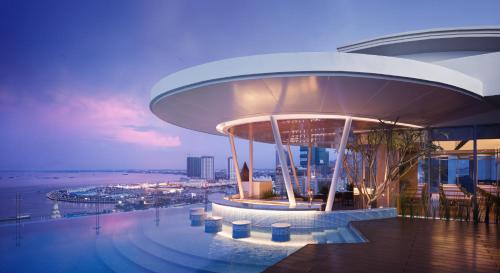 a building on the top of a building with a city at Hotel Emion Phnom Penh in Phnom Penh