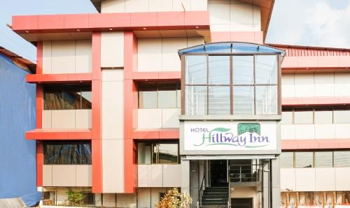 a building with a sign in front of it at Treebo Hillway Inn Main Market in Mahabaleshwar