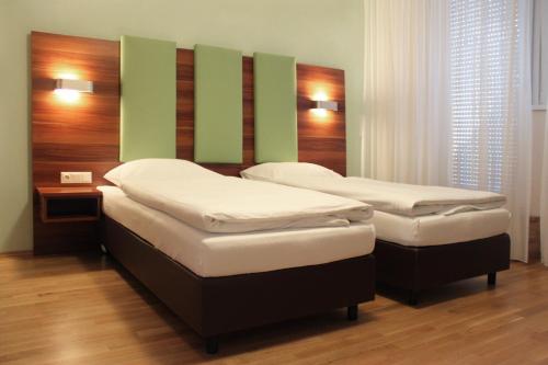 
מיטה או מיטות בחדר ב-Sky Apartments Vienna
