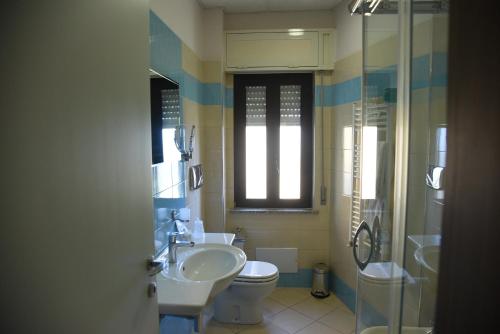 a bathroom with a sink and a toilet and a shower at Hotel Niagara in Catanzaro Lido
