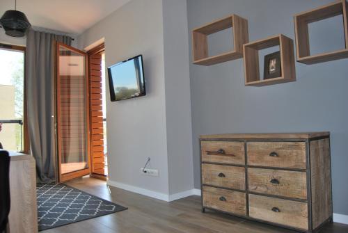 Televisyen dan/atau pusat hiburan di Ambar Apartament
