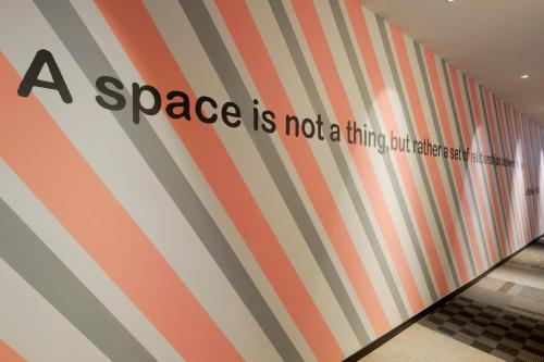 aspace is not a thing but a place with striped walls at amba Taipei Ximending in Taipei