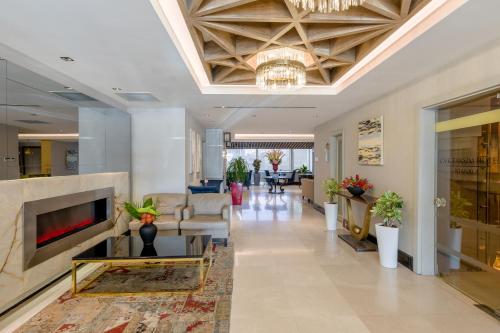 A television and/or entertainment centre at CVK Taksim Hotel Istanbul