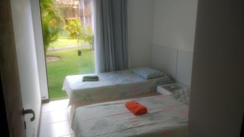 เตียงในห้องที่ Quinta das Lagoas Residence