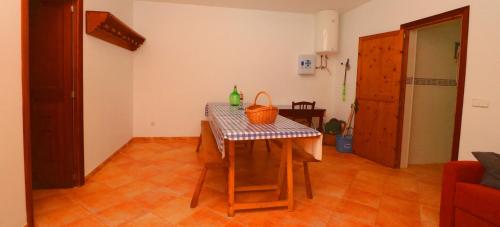 a table with a basket on it in a room at Can Crestall in Campos
