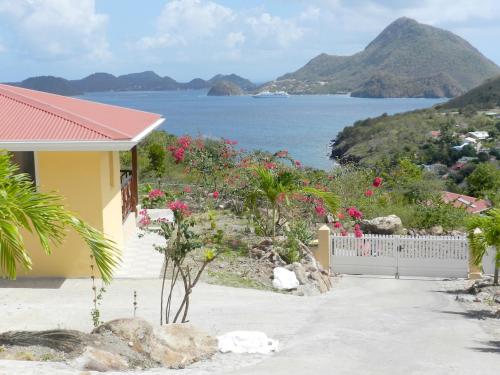 a house with a view of the ocean at Coco D'Iles in Terre-de-Bas