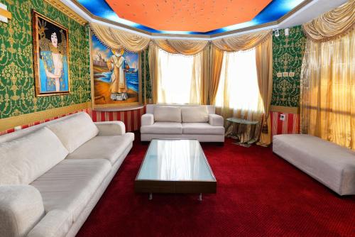 a living room with a couch and a table at Hotel Boyana - Free Parking in Sofia