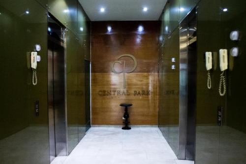 a elevator in a building with a sign on the wall at Central Park Hotel & Casino in Panama City