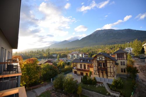 a view of a town with mountains in the background at Trio Tatry in Smokovce