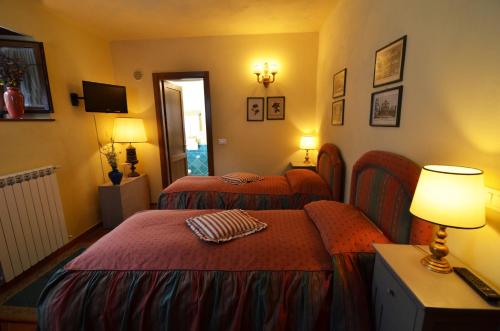 Postel nebo postele na pokoji v ubytování Agriturismo Il Passeggere