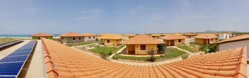 a row of houses with solar panels on the roof at Villa Maris Ecolodge in Morro