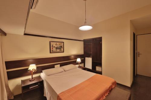 Cama ou camas em um quarto em Hotel Pousada São Francisco