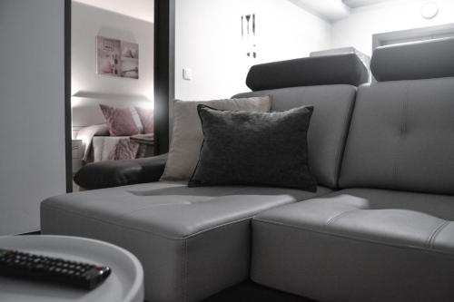 a living room with a couch and a mirror at Anevan in Vidago