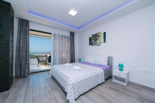 Posteľ alebo postele v izbe v ubytovaní Apartment Roso