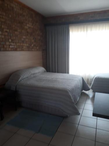 Ένα ή περισσότερα κρεβάτια σε δωμάτιο στο Dream lodging apartment
