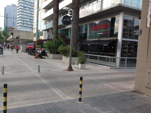 an empty street in front of a building at Departamento Zona Puerto De Olivos in Olivos