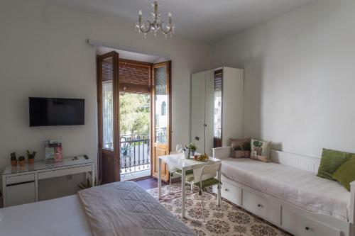 a living room with a couch and a table at Suite Plaza de la Laguna by Dulce in Ayamonte