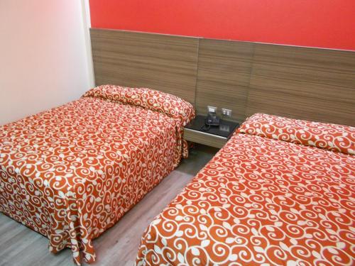 Voodi või voodid majutusasutuse Hotel Dharma toas
