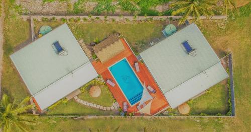 an overhead view of two buildings with a swimming pool at Cook Islands Holiday Villas - Turangi Lagoon in Muri