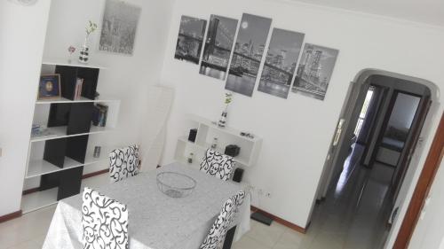 a dining room with a table and chairs at Tavira sweet home in Tavira