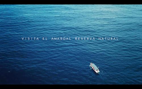 a small boat in the middle of the water at Lodge El Amargal - Reserva Natural, Ecoturismo & Surf in Nuquí
